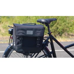La sacohe NewLooxs Origin fixée au porte-bagage arrière d'un vélo cargo NIHOLA